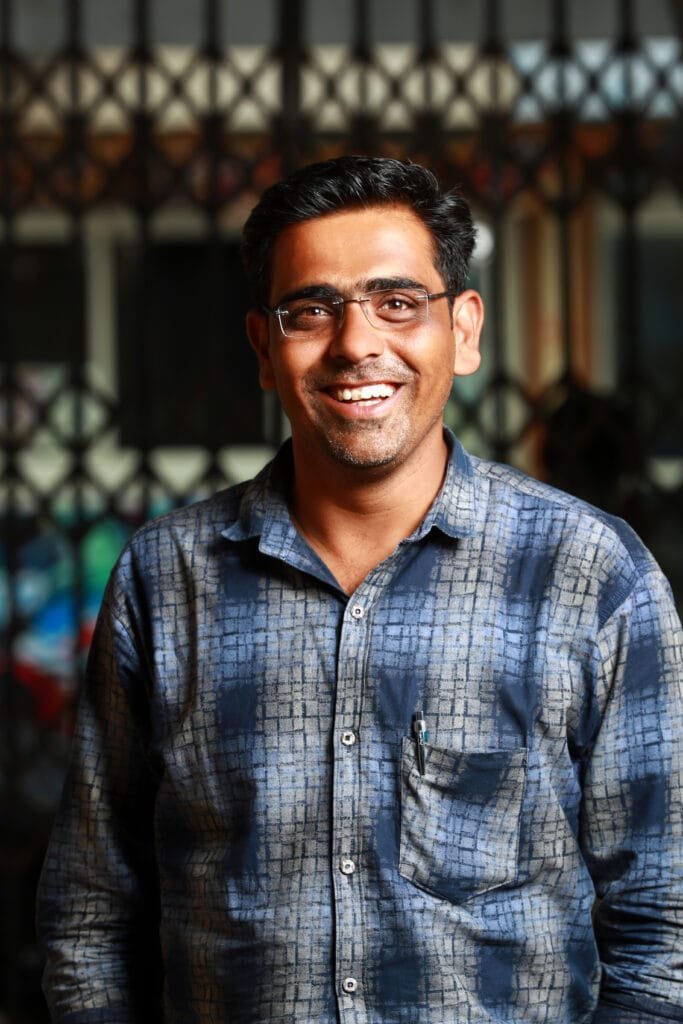 young-indian-businessm-selective-focus-shallow-depth-field-follow-focus-blur